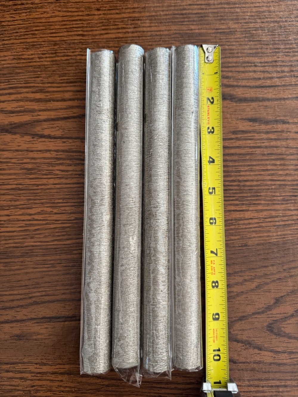 Set of 4 Metallic Silver Candles. Never used in wrappers.